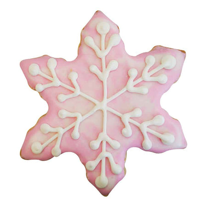 Pink frosted snowflake-shaped cookie with delicate white icing details.