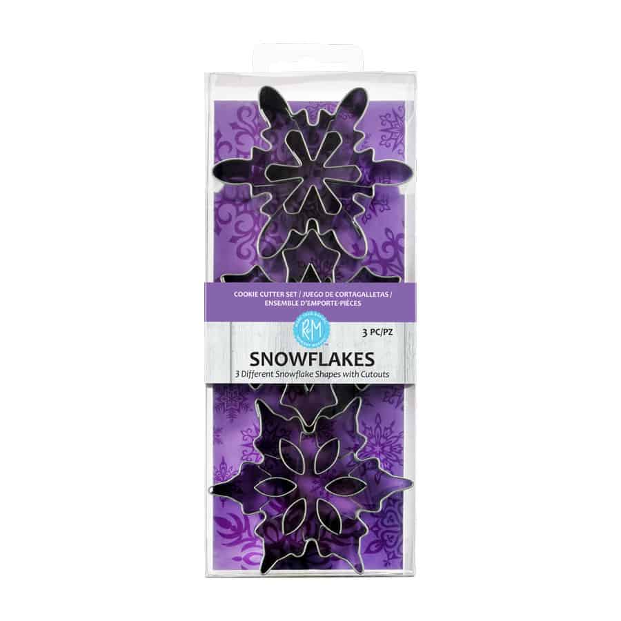 Snowflake Cookie Cutter Set in packaging with a purple winter-themed background.