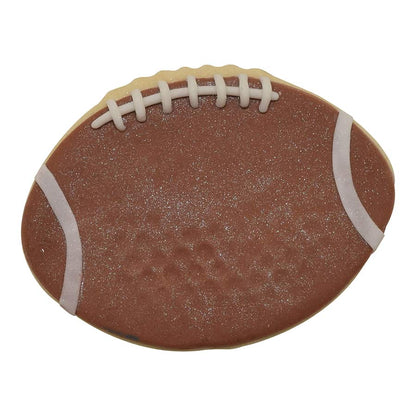 Realistic football-shaped cookie decorated with brown icing, textured details, white laces, and stripes for a game-day treat.