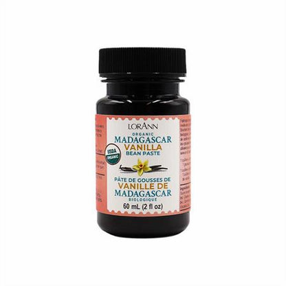 A 60 mL (2 fl oz) bottle of LorAnn Organic Madagascar Vanilla Bean Paste, a high-quality vanilla flavoring ideal for enhancing the taste of baked goods, desserts, and confections with rich and aromatic vanilla notes.