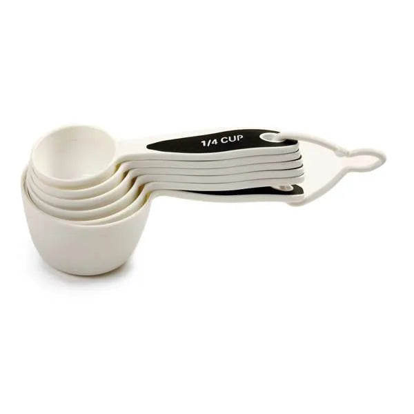 Set of white measuring cups with black handles, displayed in a nested arrangement, ideal for precise baking measurements.