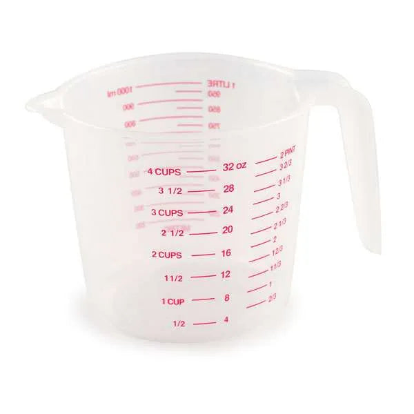 Large transparent plastic measuring cup with red markings showing measurements in milliliters and cups, specifically labeled up to 32 ounces or 4 cups.