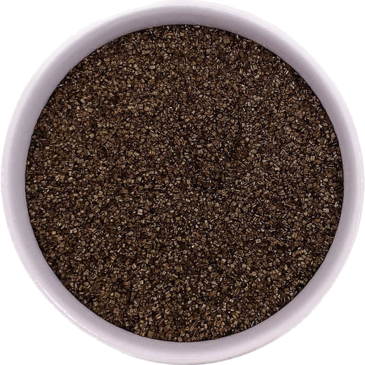 Fine brown sanding sugar in a clear bag, rich chocolate-toned crystals ideal for fall or rustic dessert themes.