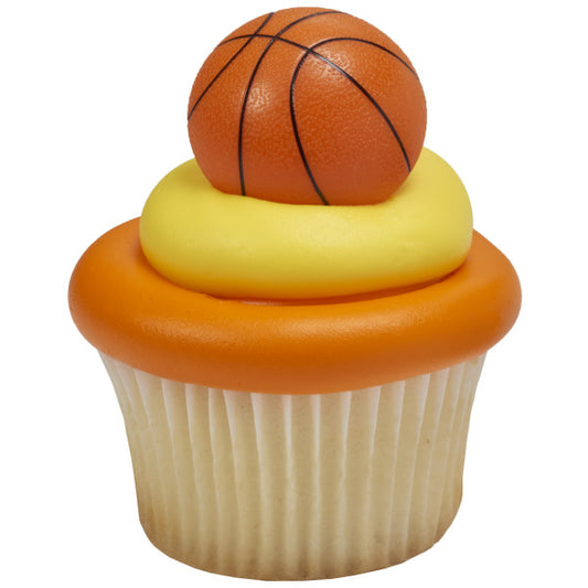 Vanilla cupcake topped with orange and yellow frosting and finished with a 3D basketball cupcake ring.
