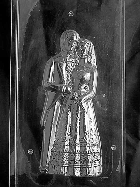 Clear plastic chocolate mold showing the front half of a 10-inch bride and groom: tuxedo lapels, bouquet in hand, and layered gown textures. Designed to join with a matching back half to create a full 3D chocolate figure.