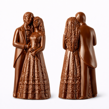 Front and back views of a 3D bride and groom chocolate figure shown side by side, featuring a couple in wedding attire with the groom in a suit and the bride in a long detailed gown and veil, standing together in an embrace.