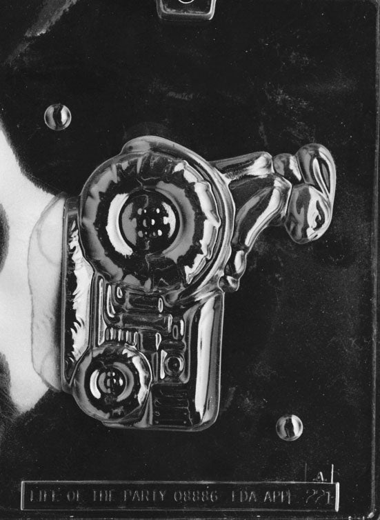 Clear plastic chocolate mold showing the front half of a bunny driving a tractor, with raised details on the bunny’s face, ears, and large tractor wheels.
