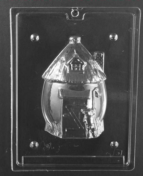 Plastic mold showing the back side of the bunny hut with a large door, small window, and textured roof elements.