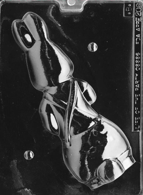 Plastic mold forming the back of the bunny figure, completing the overall outfit with strap and pocket details.