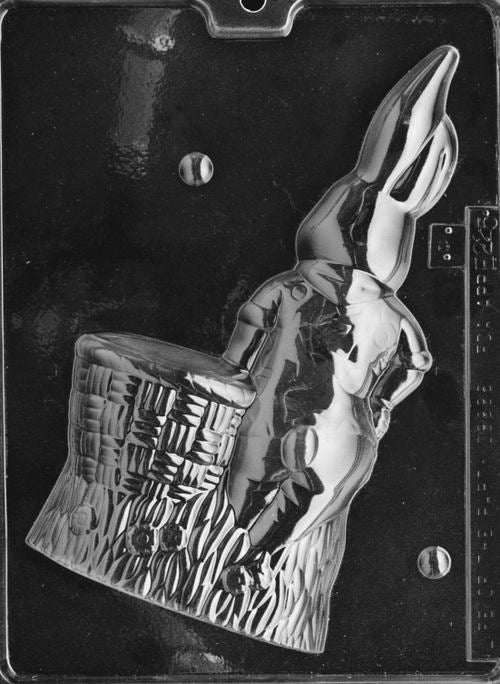 Clear plastic chocolate mold showing the matching back half of a bunny leaning on a basket, with continued basket texture and rounded contours for a complete 3D figure.