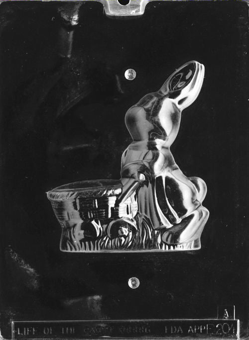 Clear plastic mold showing the front half of a sitting bunny pulling a basket-style cart, with detailed ears and grass base.
