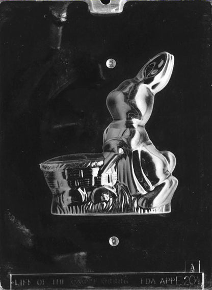 Clear plastic mold showing the front half of a sitting bunny pulling a basket-style cart, with detailed ears and grass base.