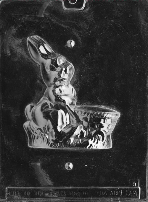 Plastic mold featuring the back half of a bunny and cart design, completing the 3D figure with rounded detail and texture.
