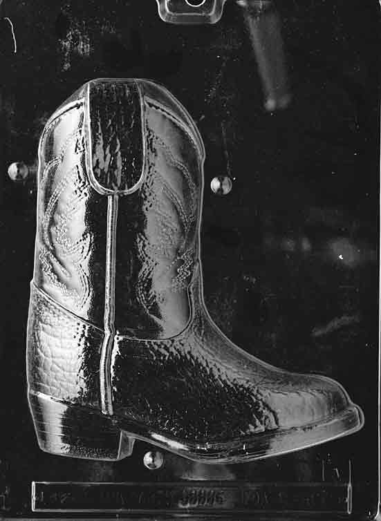 Clear plastic chocolate mold showing the front half of a detailed cowboy boot with stitched seams, textured shaft, and defined heel, designed to form a 3D chocolate boot.