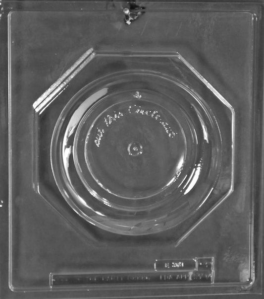 Clear plastic chocolate mold showing the matching backing piece for an octagonal chocolate plate, with a smooth circular center and recessed border for assembling a finished plate.