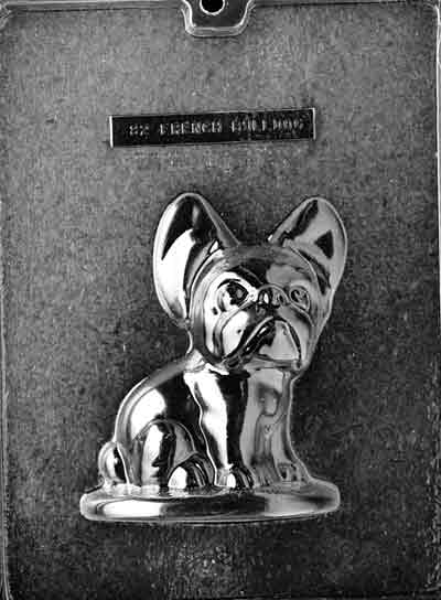 Clear plastic chocolate mold showing the front half of a seated French Bulldog with large upright ears, wide eyes, and a rounded base platform.