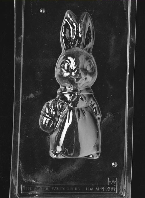 Clear plastic chocolate mold showing the front half of a tall girl bunny holding a woven basket, with raised facial features, upright ears, and outfit detailing.