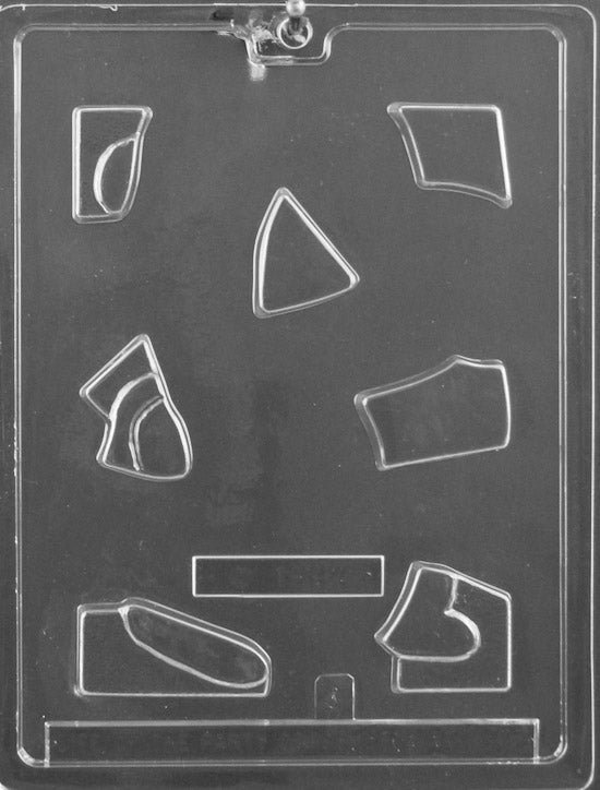 Plastic chocolate mold featuring interlocking puzzle pieces shaped to form part of a bunny.
