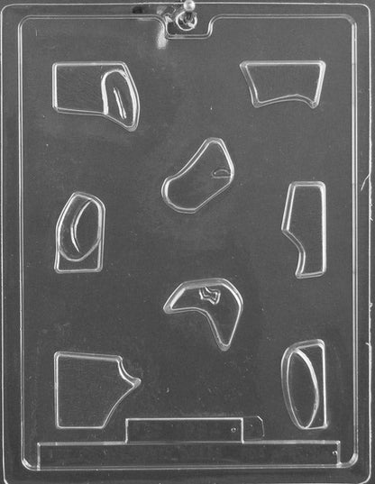 Plastic chocolate mold featuring interlocking puzzle pieces shaped to form part of a bunny.