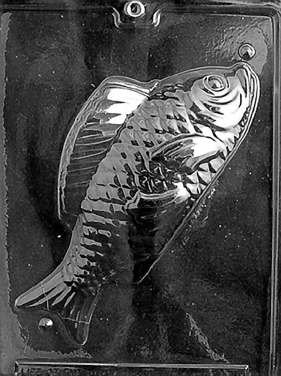 Clear plastic chocolate mold showing one half of a large fish with textured scales, detailed fins, and a curved body cavity for making a 3D chocolate fish.