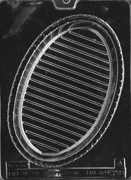 Clear plastic chocolate mold with an oval basket cavity featuring raised diagonal lines and a braided rim, designed for a large pour-style chocolate basket.