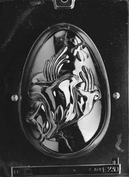 Clear plastic chocolate mold showing the front half of a large egg with raised lily flower detailing and curved petal shapes in relief.