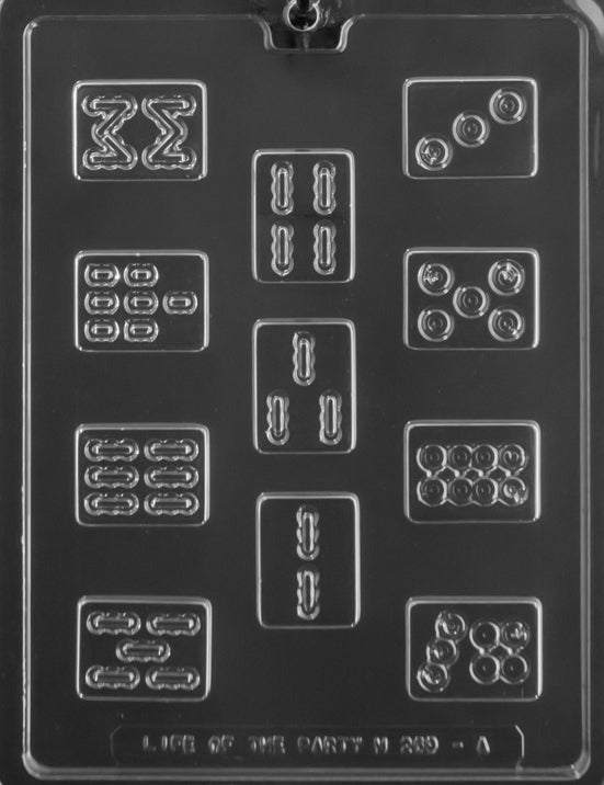 Clear plastic chocolate mold sheet with multiple small rectangular cavities shaped like Mahjong tiles, featuring embossed dot and bamboo-style patterns.