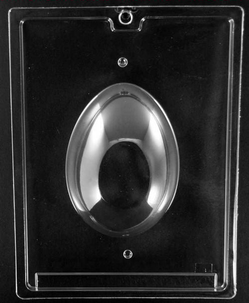 Clear plastic mold displaying the second half of a smooth chocolate egg mold, forming a full panoramic egg when combined with its pair.