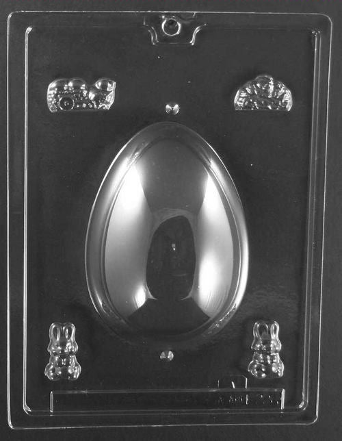 Clear plastic chocolate mold with a large egg-shaped cavity and small bonus figure cavities around it, including tiny bunnies and garden icons for decorating a panoramic chocolate egg.