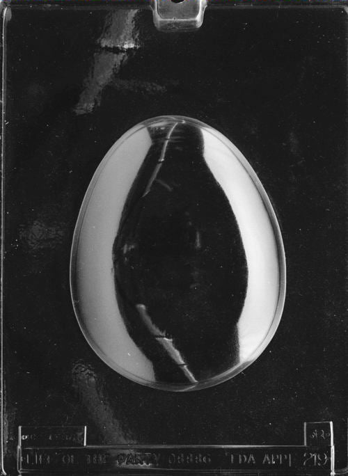 Clear plastic chocolate mold showing an egg-shaped cavity with vertical line texture inside, designed as one half of a 3D pour egg.