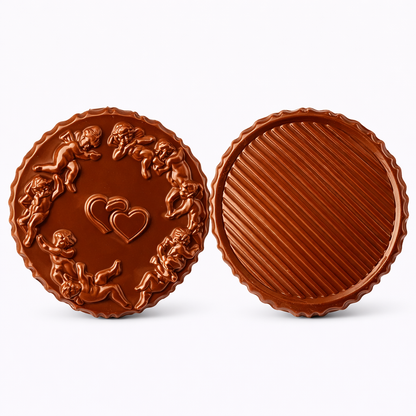 Top and tray views of a round 3D chocolate pour box shown side by side, with one side featuring a ring of cherubs surrounding two hearts in the center, and the other side showing a smooth round surface with diagonal stripe detailing.