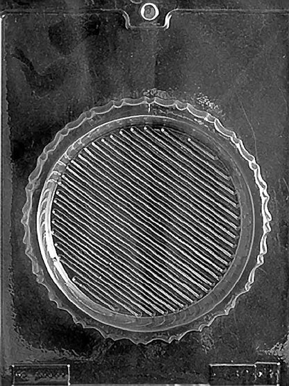 Clear plastic mold showing a round chocolate box base with diagonal textured lines and a scalloped edge, designed to pair with the Cupid lid.