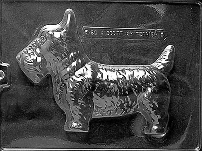 Clear plastic chocolate mold showing the front half of a Scottish Terrier in profile with a boxy body, short legs, and textured coat detail.