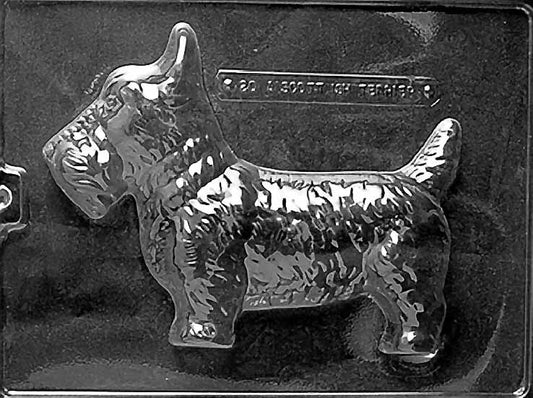 Clear plastic chocolate mold showing the front half of a Scottish Terrier in profile with a boxy body, short legs, and textured coat detail.