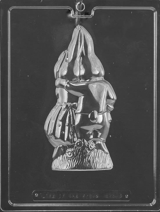 Clear plastic chocolate mold showing the back half of a cuddling bunny couple, with rounded contours, tail details, and a small floral accent at the base.