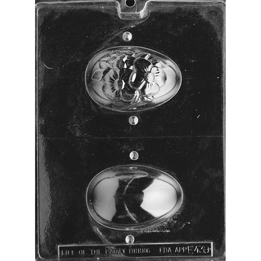 Two-piece hollow 3D Easter egg chocolate mold with one raised dogwood flower half and one smooth half, measuring approximately 3 5/8 x 2 1/2 inches