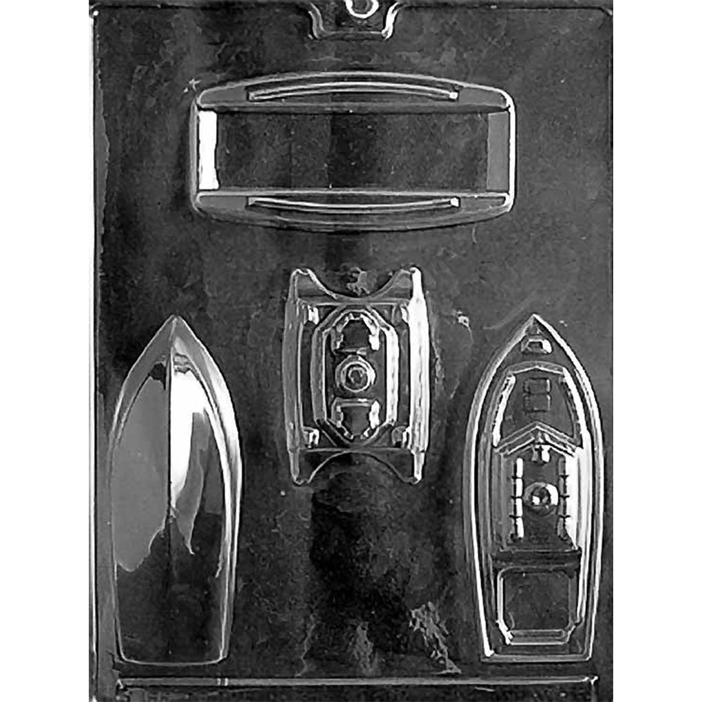 Clear plastic 3D boat chocolate mold with four cavities, including a pointed hull piece, a detailed cabin-style boat panel, and additional parts for assembling finished boats