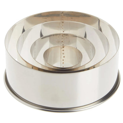 Nested set of four round stainless steel cutters stacked inside each other on a white background, showing multiple circular sizes.