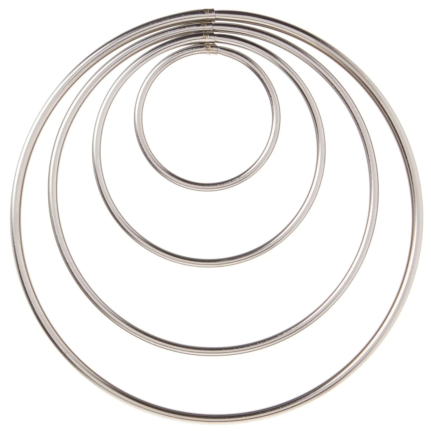 Top-down view of four round cutters nested concentrically, forming a target-like set of circles on a white background.