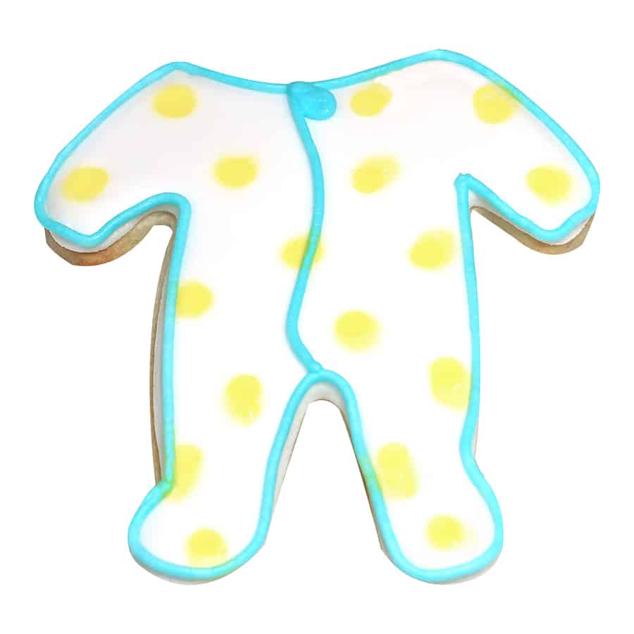 Decorated cookie shaped like footie pajamas with yellow polka dots and blue trim.