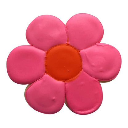 Decorated pink flower cookie with scalloped edges, featuring a vibrant orange center.