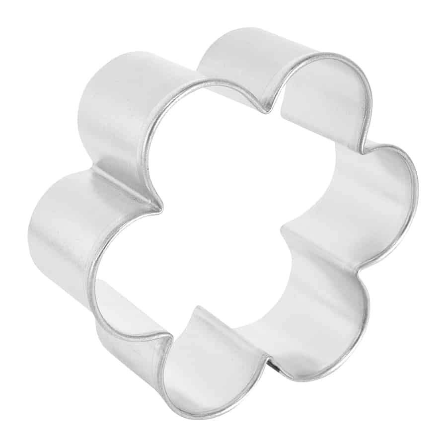 Angled side view of the scalloped biscuit cutter, highlighting its ridged edges.