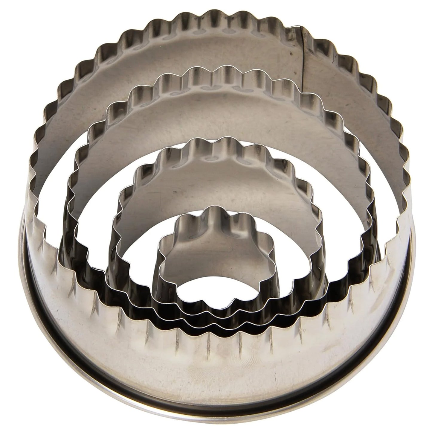 Nested set of four stainless steel round fluted cookie cutters stacked inside each other, showing scalloped edges in multiple sizes on a white background.