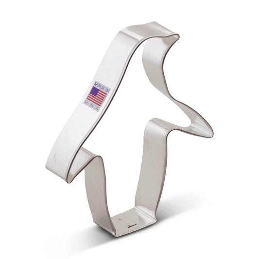 Metal penguin-shaped cookie cutter with a slightly curved body and flared wings.