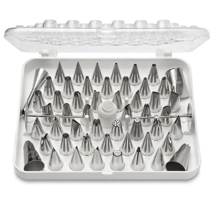 Open Ateco 783 55-piece pastry tube decorating set with stainless steel piping tips, coupler, flower nails, and cleaning brush in a plastic storage case.