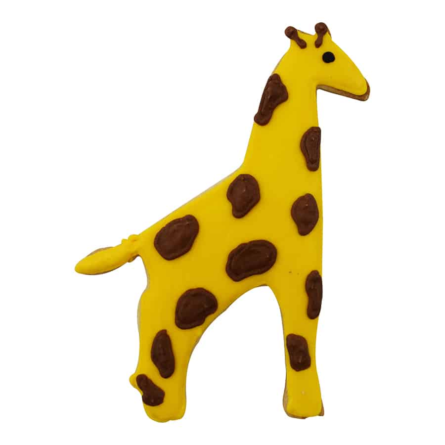 Decorated giraffe-shaped cookie featuring a yellow base with brown spots, created using a giraffe cookie cutter.