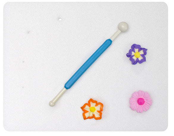 Modeling Pad with Modeling Tool and Flowers on top