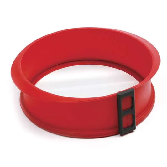 Red silicone round springform pan with a black latch, designed for baking cakes and cheesecakes.