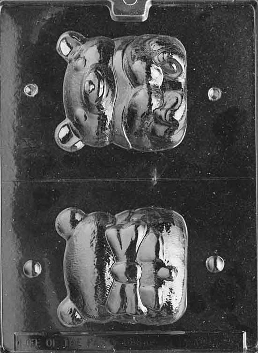Two-part mold forming a 3D seated teddy bear with rounded ears and bow detail.