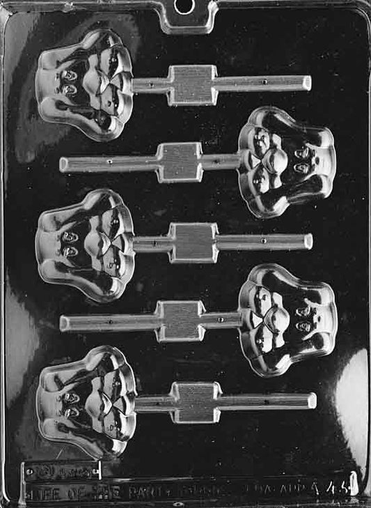 Lollipop mold with a sitting hound puppy, long ears and friendly face.
